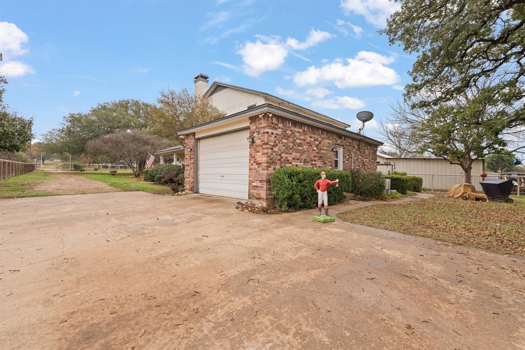 3500 Trails End Road Burleson, TX 76028 - Photo 17 of 24 a view of a house with a yard and garage