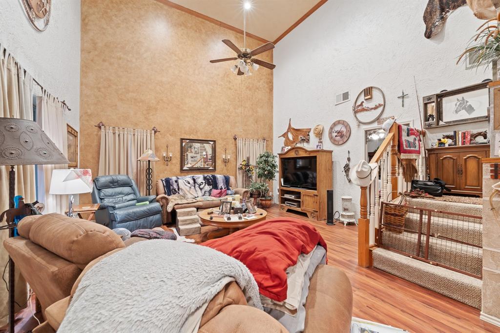 3500 Trails End Road Burleson, TX 76028 - Photo 4 of 24 a living room with patio furniture and a flat screen tv