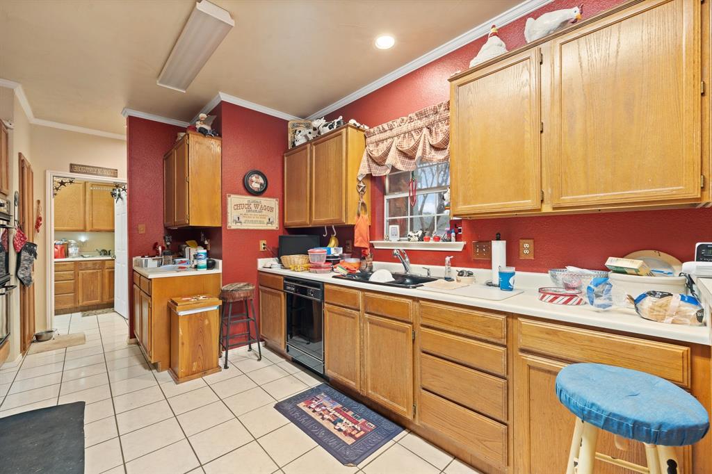 3500 Trails End Road Burleson, TX 76028 - Photo 7 of 24 a kitchen with stainless steel appliances granite countertop a sink cabinets and window