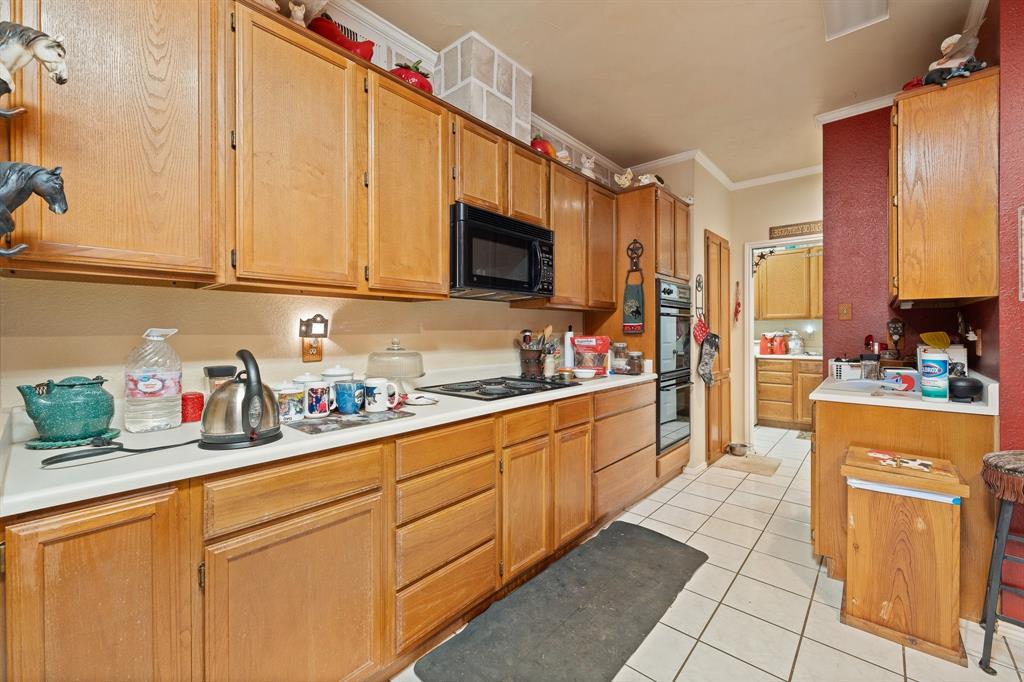 3500 Trails End Road Burleson, TX 76028 - Photo 8 of 24 a kitchen with cabinets a sink and appliances