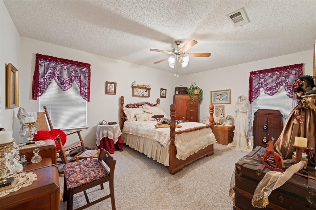 3500 Trails End Road Burleson, TX 76028 - Photo 10 of 24 a bedroom with furniture and a chandelier