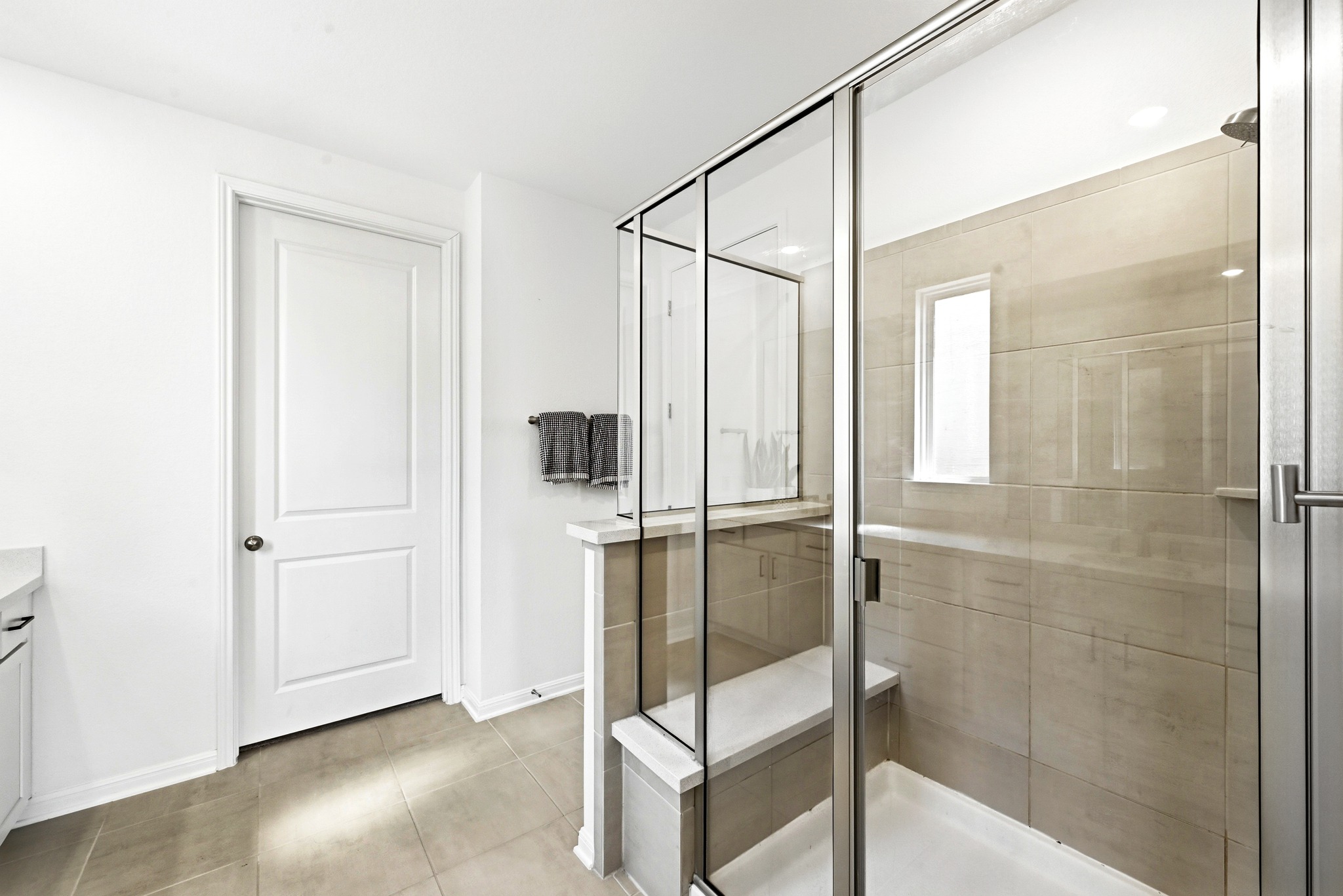 12401 Dairywork Road Buda, TX 78610 - Photo 17 of 28 Clean lines and a spacious glass-enclosed shower define this modern bathroom design.