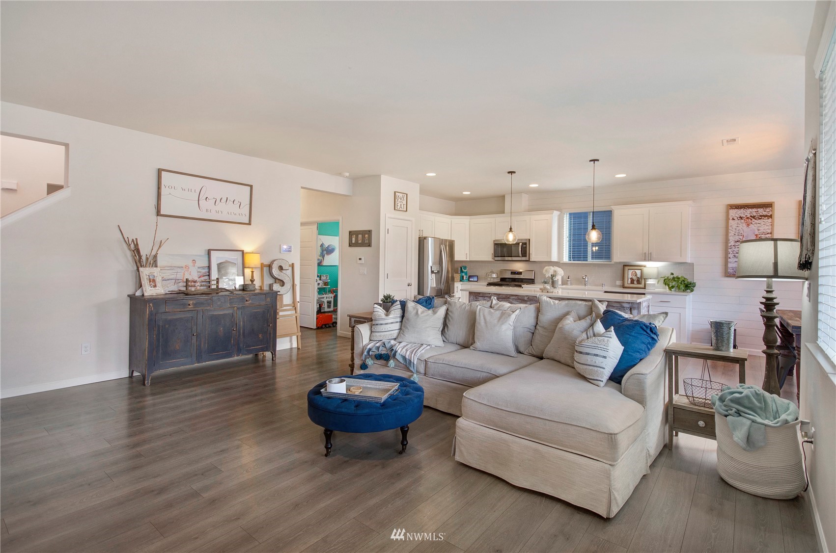 20206 18th Ave Court East Spanaway, WA 98387 - Photo 12 of 37 a living room with furniture and kitchen view