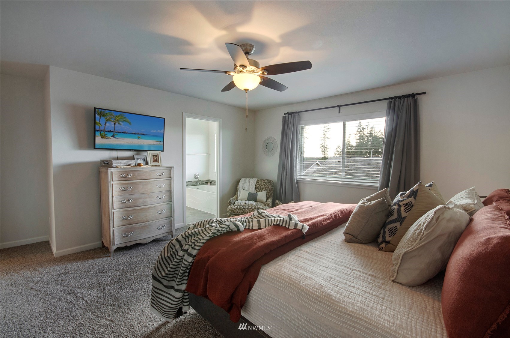 20206 18th Ave Court East Spanaway, WA 98387 - Photo 19 of 37 a bedroom with a bed and a window