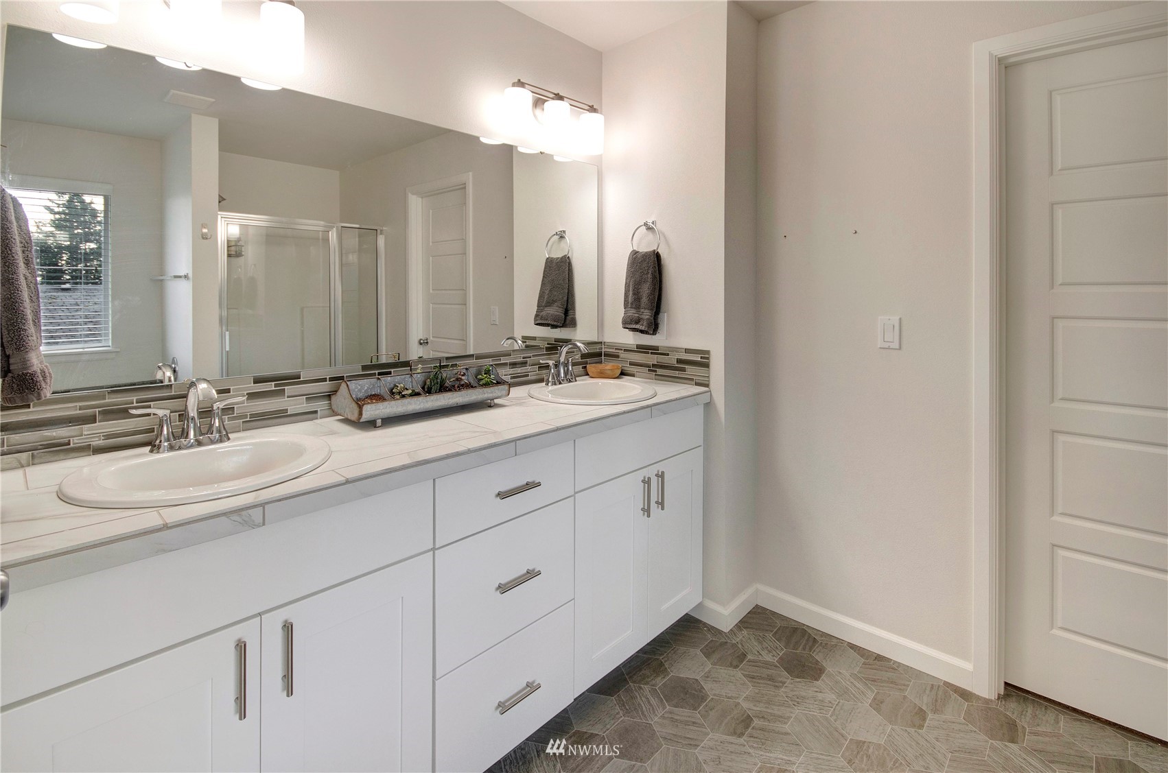 20206 18th Ave Court East Spanaway, WA 98387 - Photo 20 of 37 a bathroom with a sink and a mirror