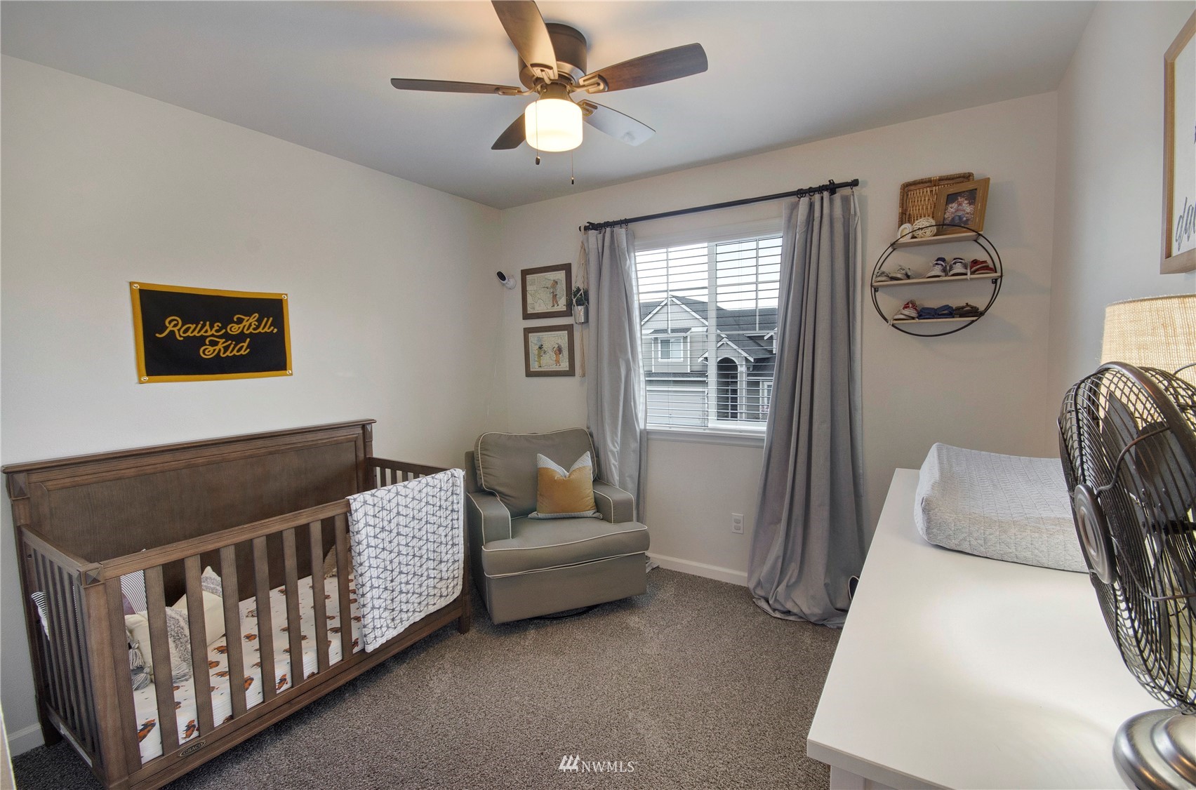 20206 18th Ave Court East Spanaway, WA 98387 - Photo 24 of 37 a bedroom with furniture and a window