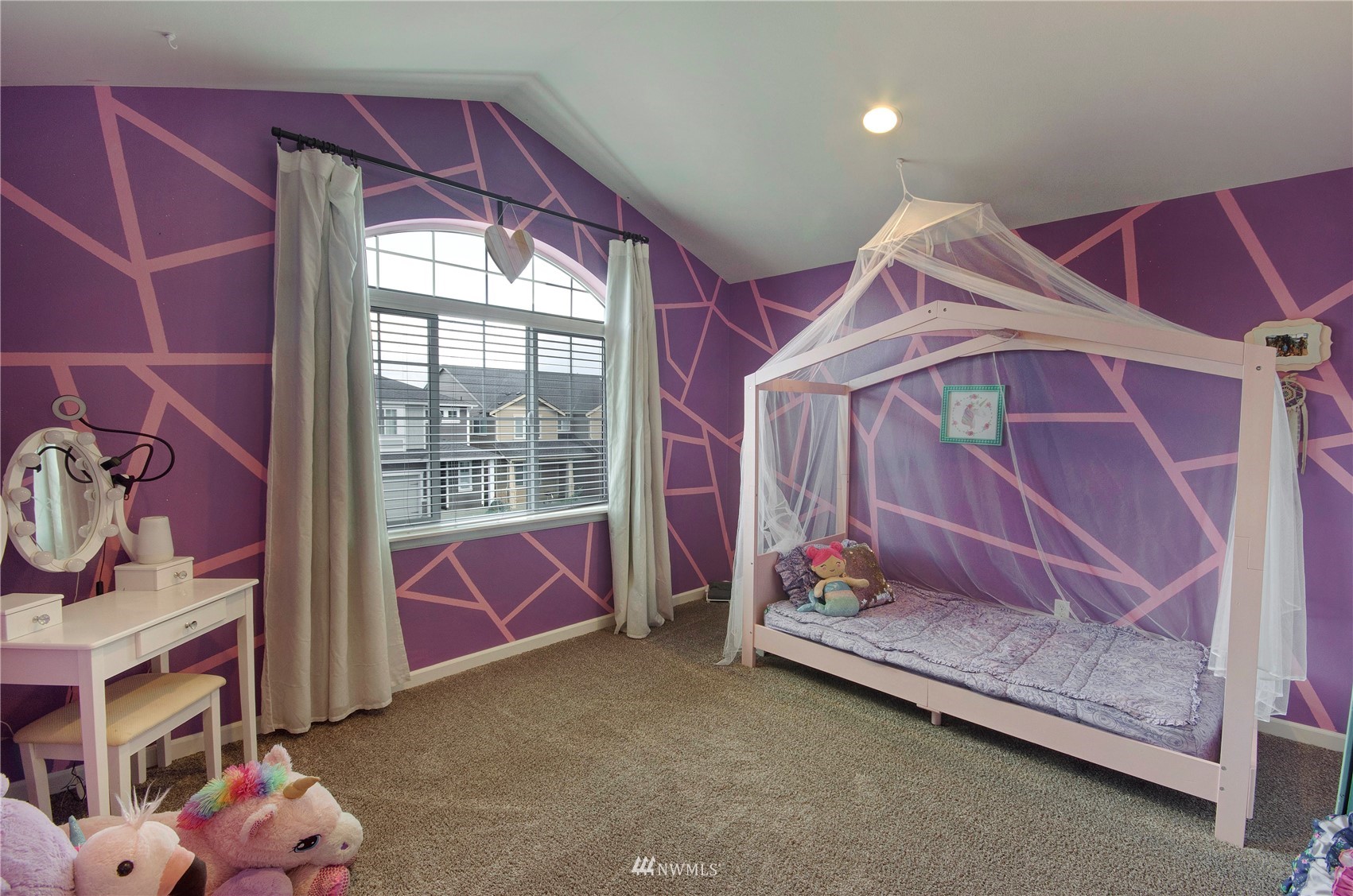 20206 18th Ave Court East Spanaway, WA 98387 - Photo 25 of 37 a bedroom with a bed and a window