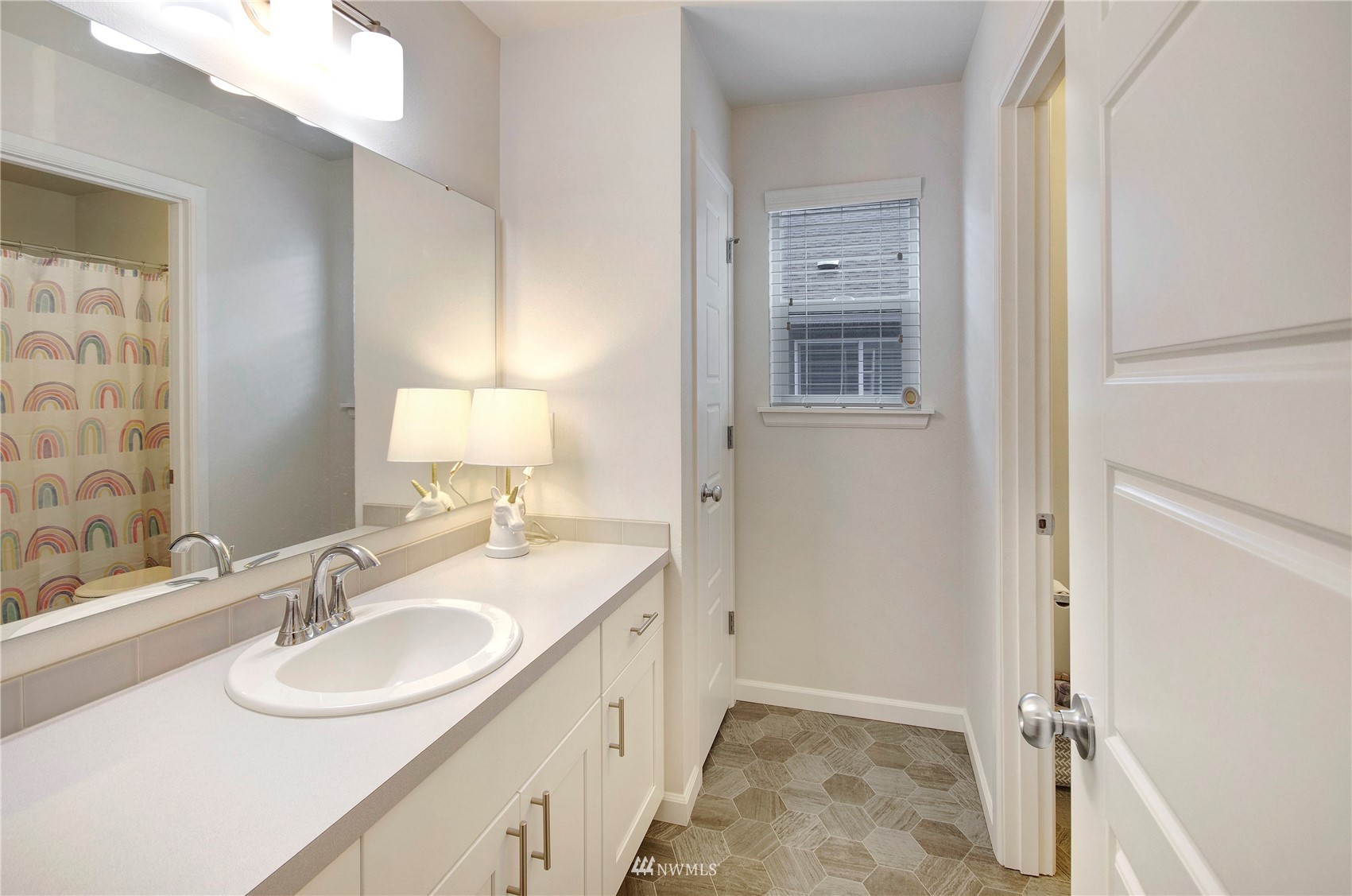 20206 18th Ave Court East Spanaway, WA 98387 - Photo 28 of 37 a bathroom with a sink double vanity and a mirror