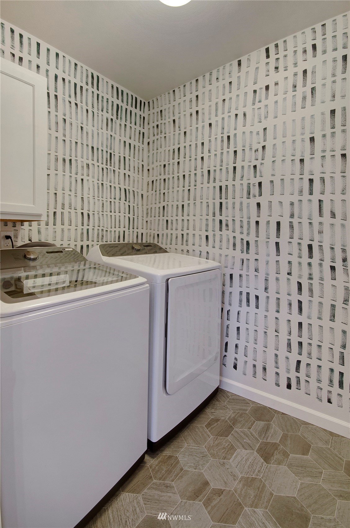 20206 18th Ave Court East Spanaway, WA 98387 - Photo 29 of 37 a view of a utility room with cabinets