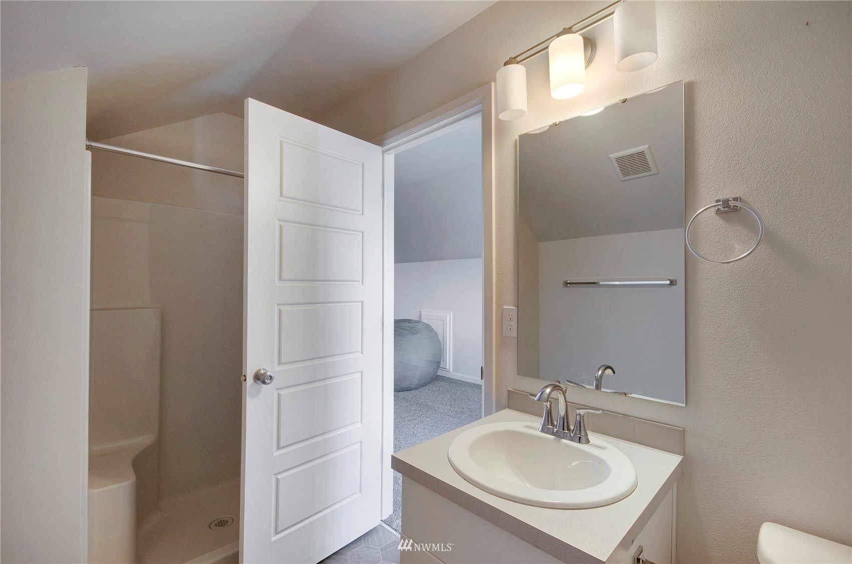 20206 18th Ave Court East Spanaway, WA 98387 - Photo 31 of 37 a bathroom with a sink and a mirror