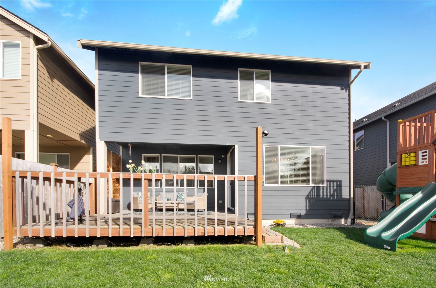 20206 18th Ave Court East Spanaway, WA 98387 - Photo 34 of 37 a front view of a house with a yard table and chairs