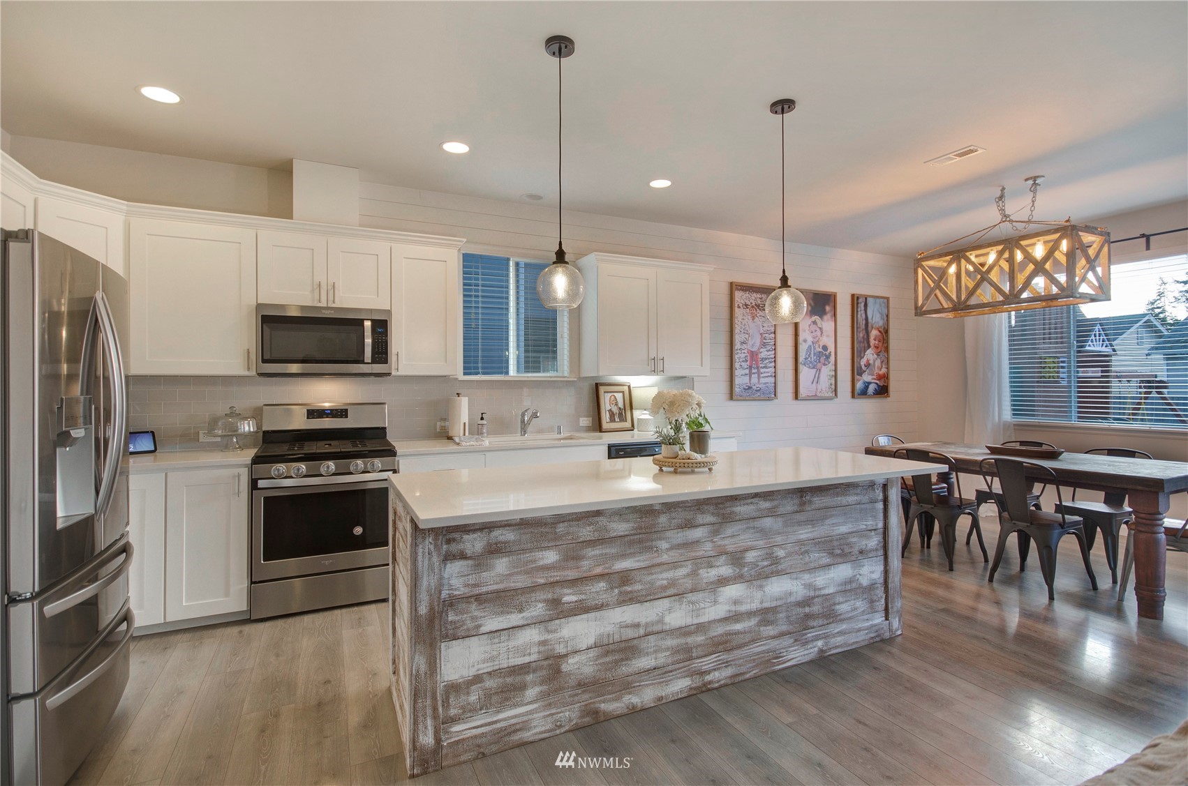 20206 18th Ave Court East Spanaway, WA 98387 - Photo 7 of 37 a large kitchen with kitchen island a large island in the center