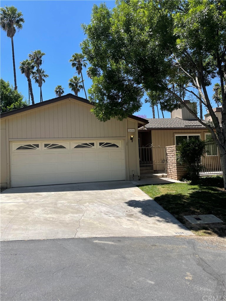2696 Laramie Road Riverside, CA 92506 - Photo 1 of 1 front view of a house with a yard