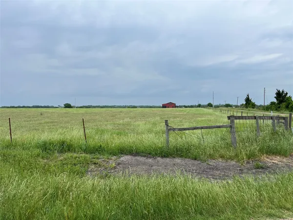 a view of a lake with a yard