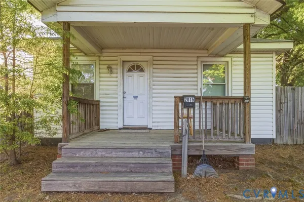 a front view of a house with stairs