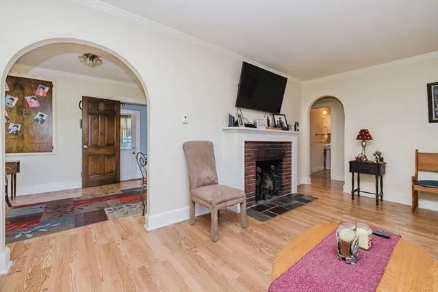 a living room with furniture fireplace and flat screen tv