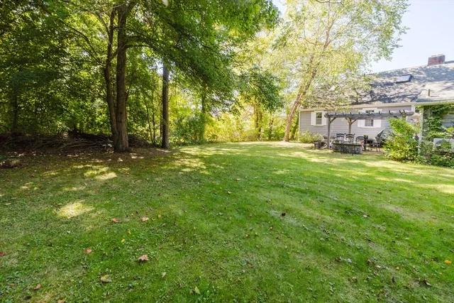 a swimming pool with trees in the background