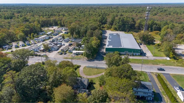 an aerial view of house with yard swimming pool and outdoor seating