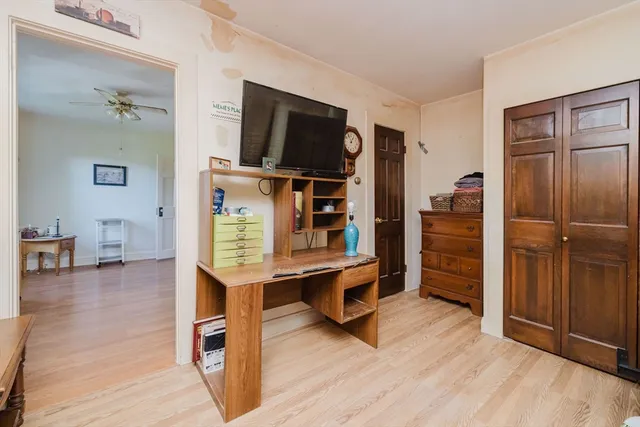 a room with furniture and wooden floor