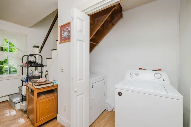 a view of storage and utility room with washer and dryer