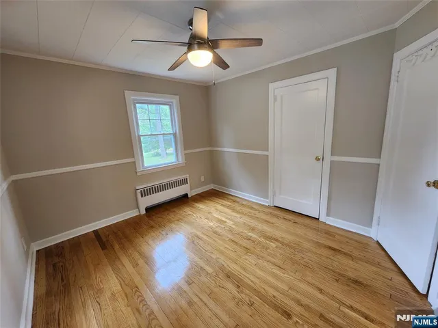 a bathroom with a bathtub shower sink vanity and toilet