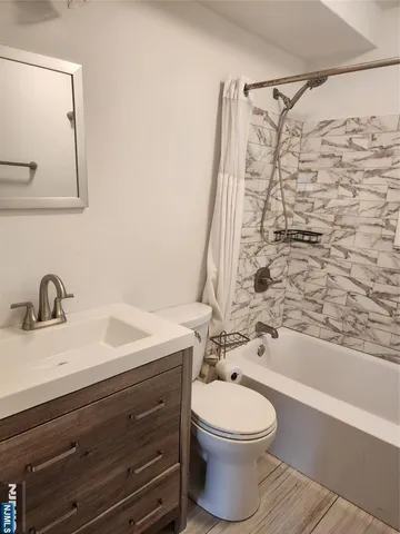 a room with water heater and refrigerator