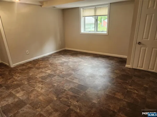 a room with a sink and a washer dryer