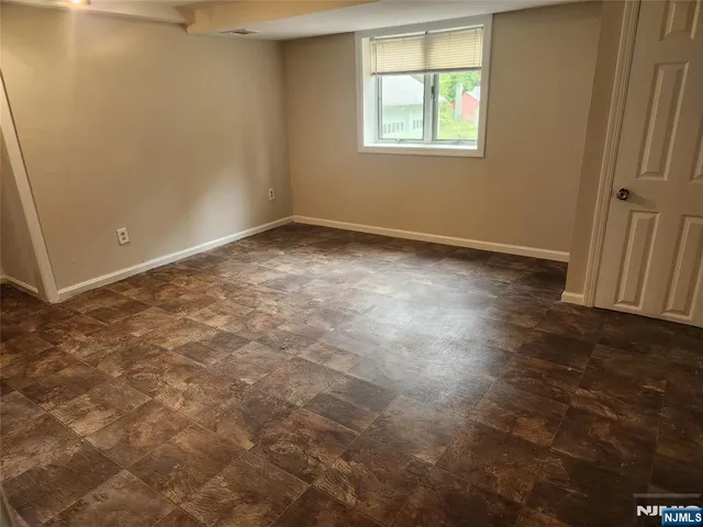 a room with a sink and a washer dryer