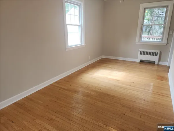 a kitchen with granite countertop a stove and a microwave