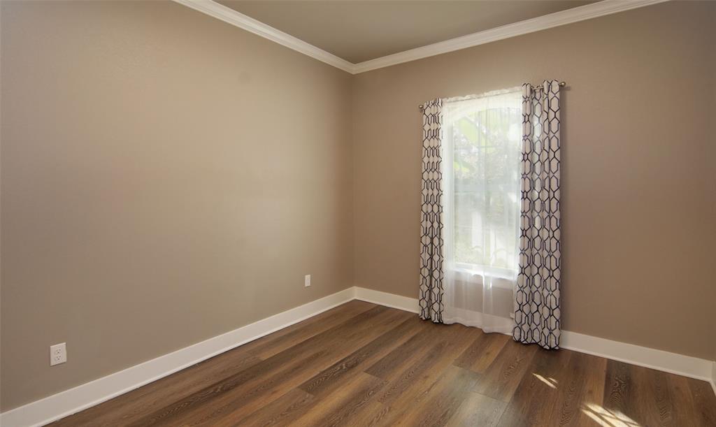 224 Pr 5294 Yantis, TX 75497 - Photo 24 of 35 an empty room with wooden floor and windows