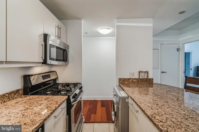 a kitchen with a stove and a microwave