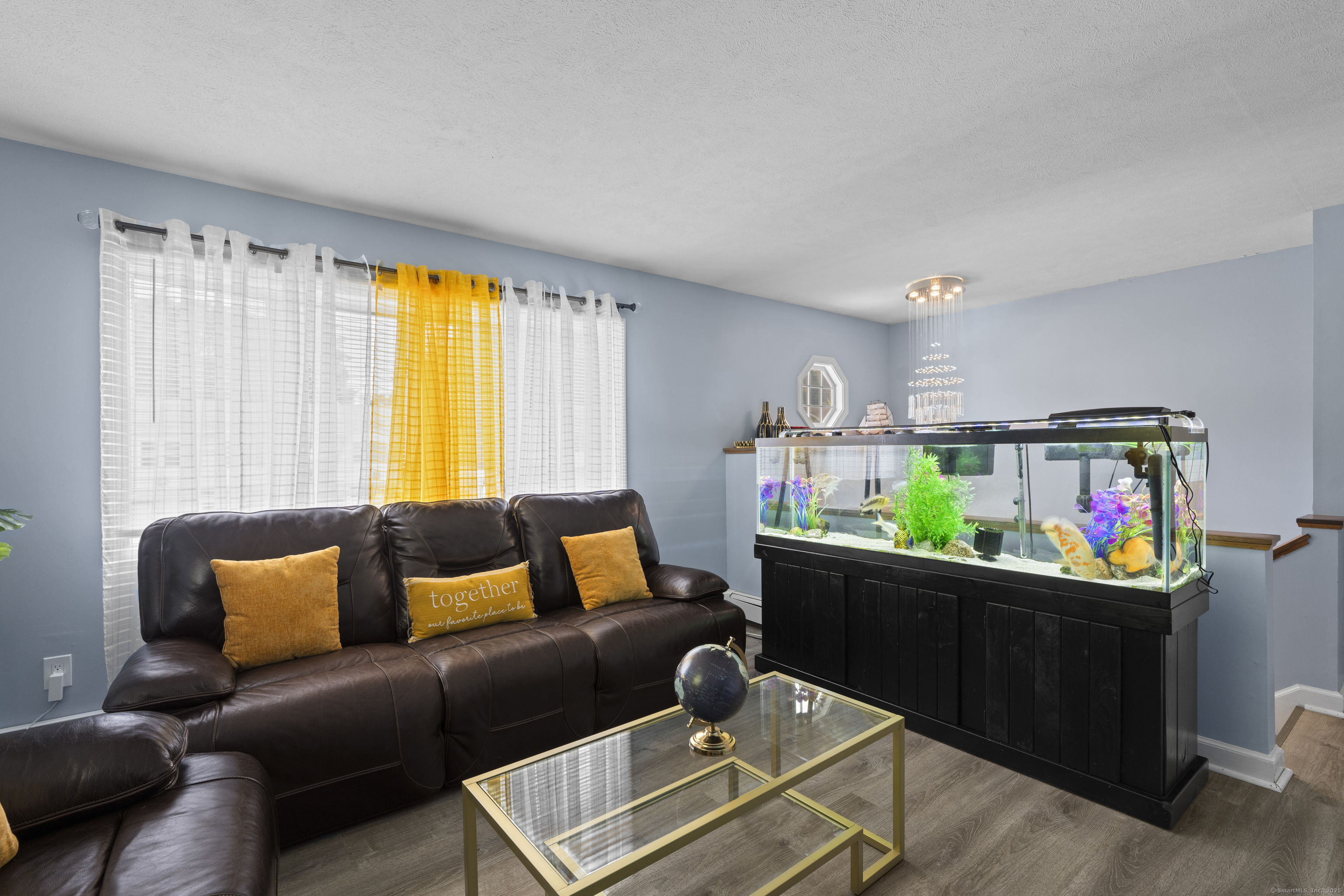 63 Johl Drive Groton, CT 06340 - Photo 11 of 40 a living room with furniture and a window