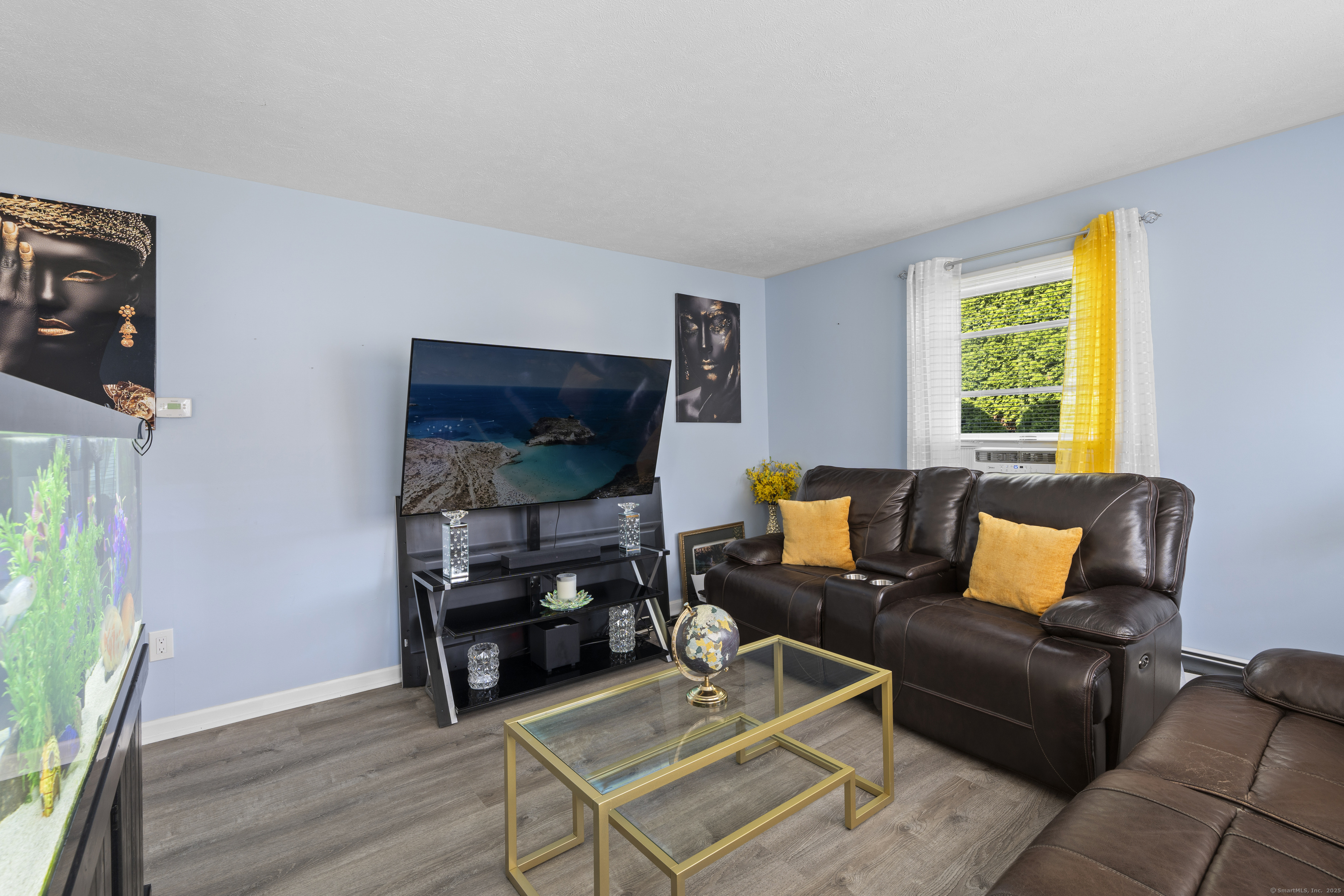 63 Johl Drive Groton, CT 06340 - Photo 12 of 40 a living room with furniture and a flat screen tv