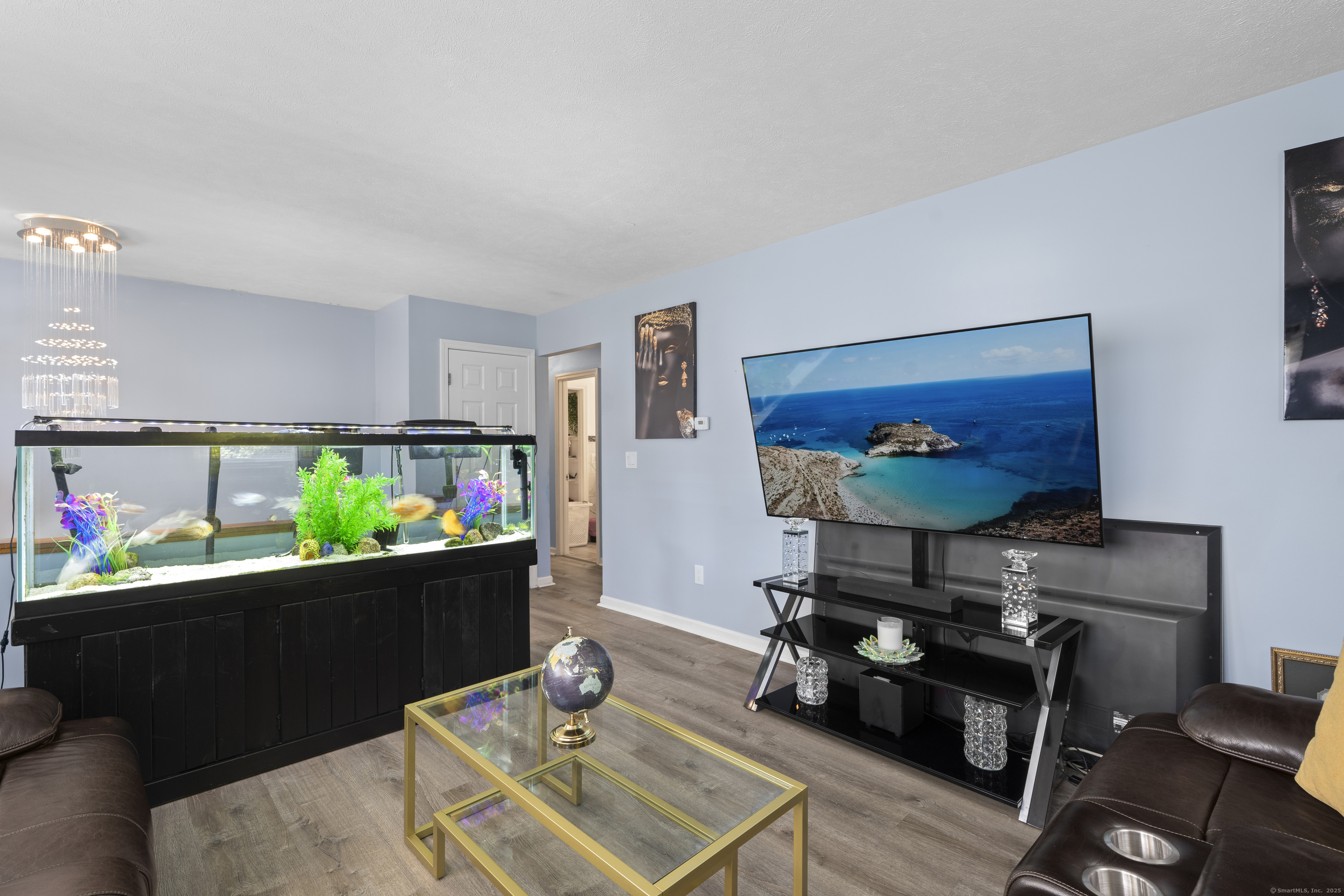 63 Johl Drive Groton, CT 06340 - Photo 15 of 40 a living room with furniture and a flat screen tv