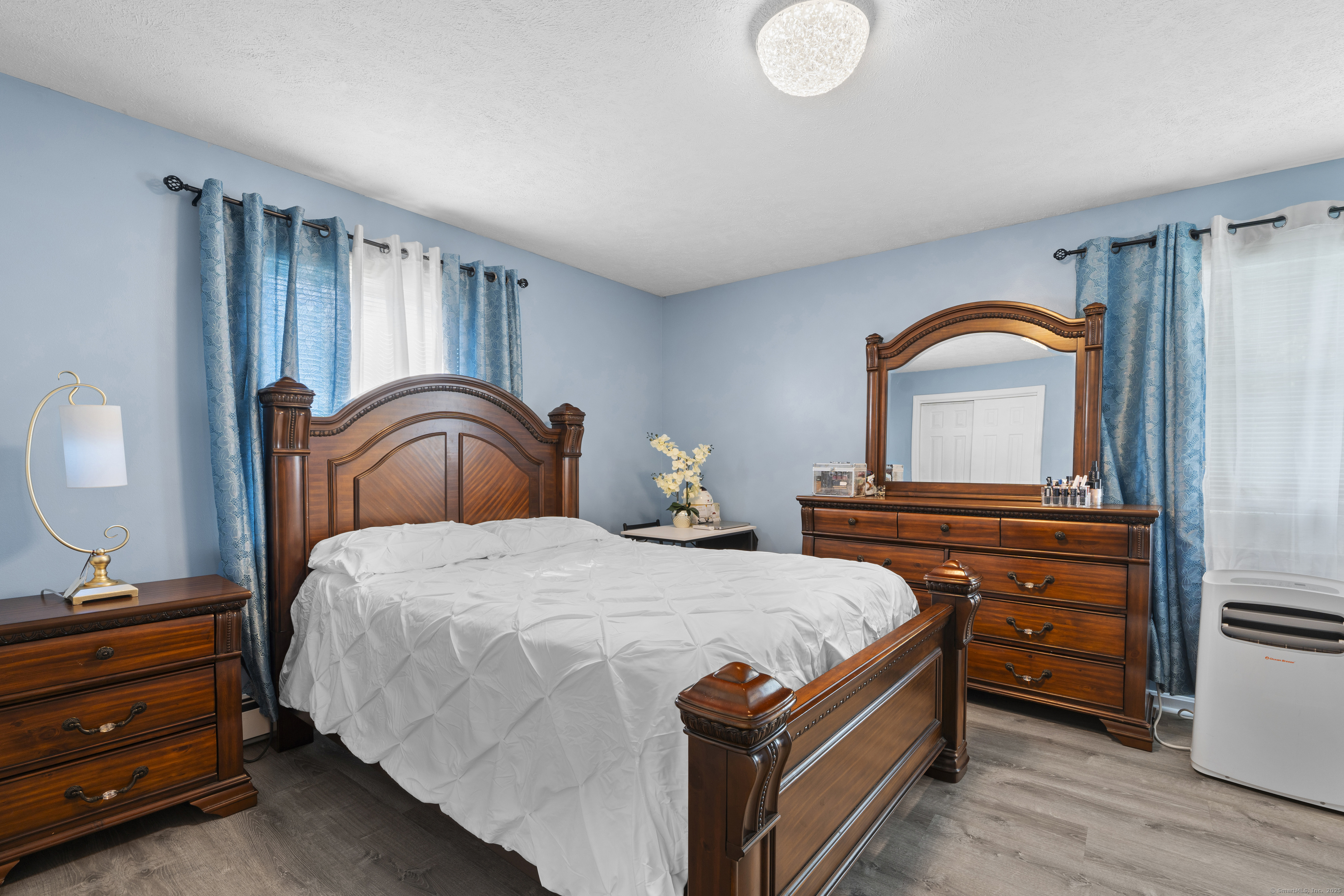 63 Johl Drive Groton, CT 06340 - Photo 17 of 40 a bedroom with a bed and a dresser