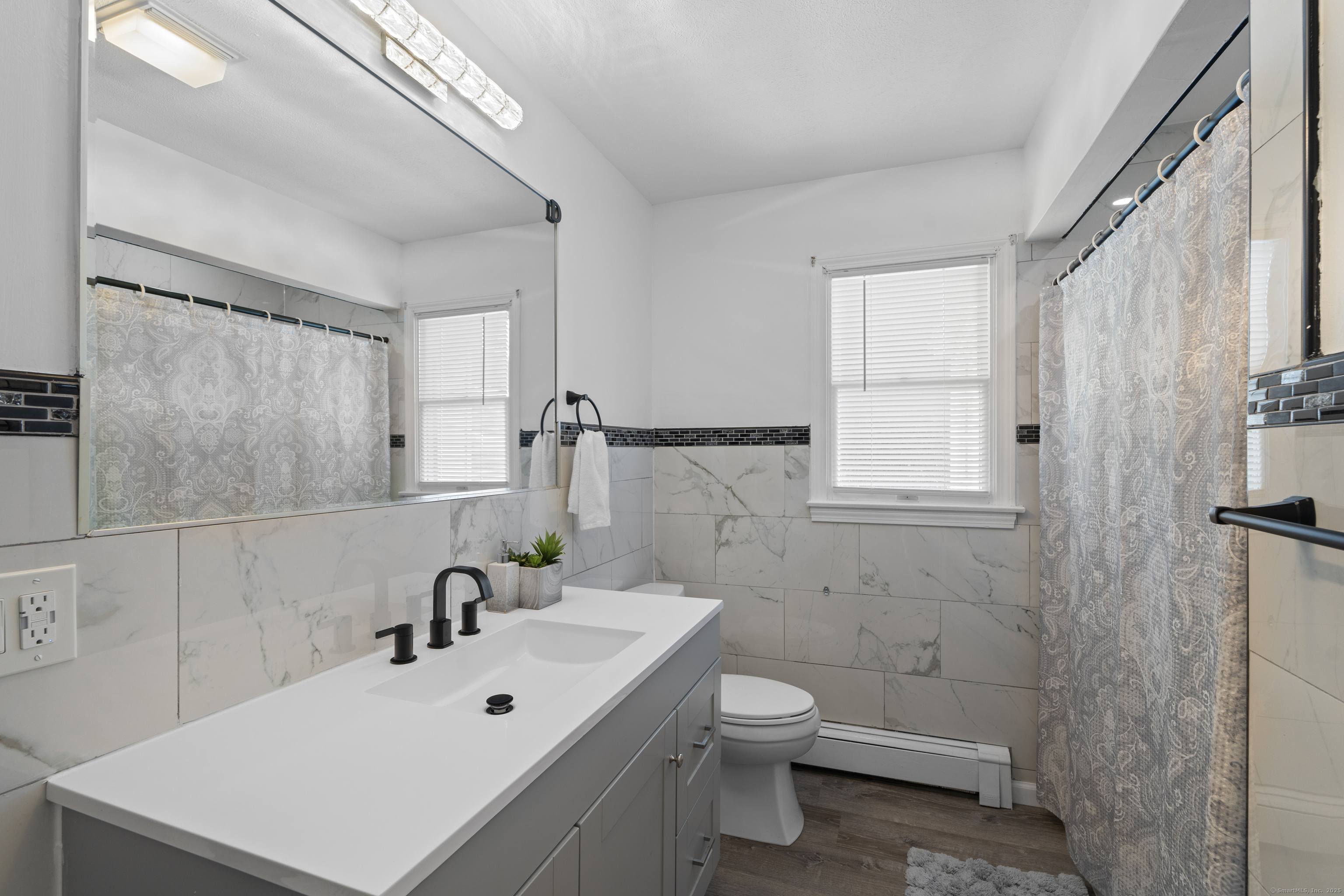 63 Johl Drive Groton, CT 06340 - Photo 21 of 40 a bathroom with a sink mirror and toilet