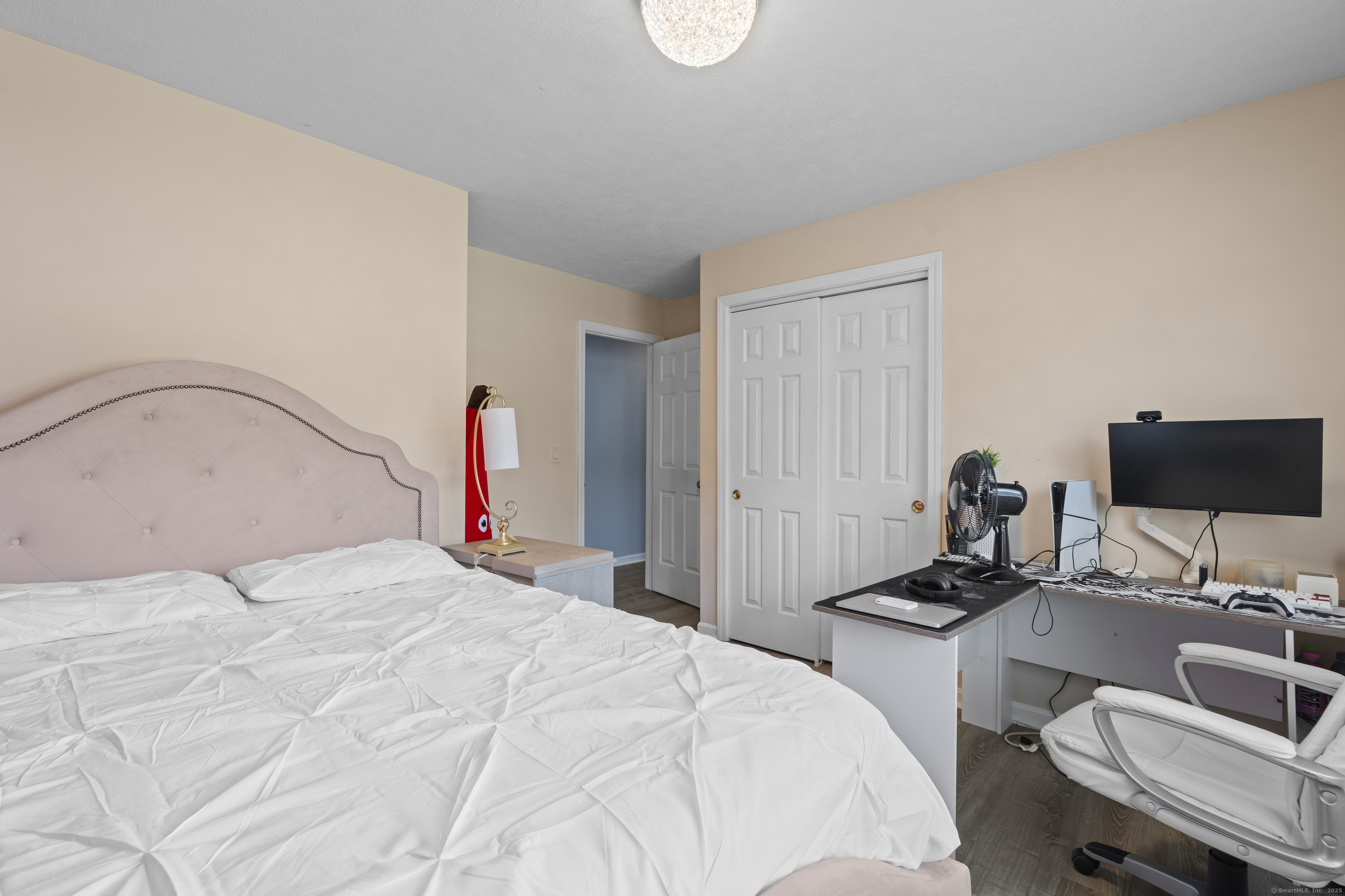 63 Johl Drive Groton, CT 06340 - Photo 22 of 40 a bedroom with a bed and a flat screen tv