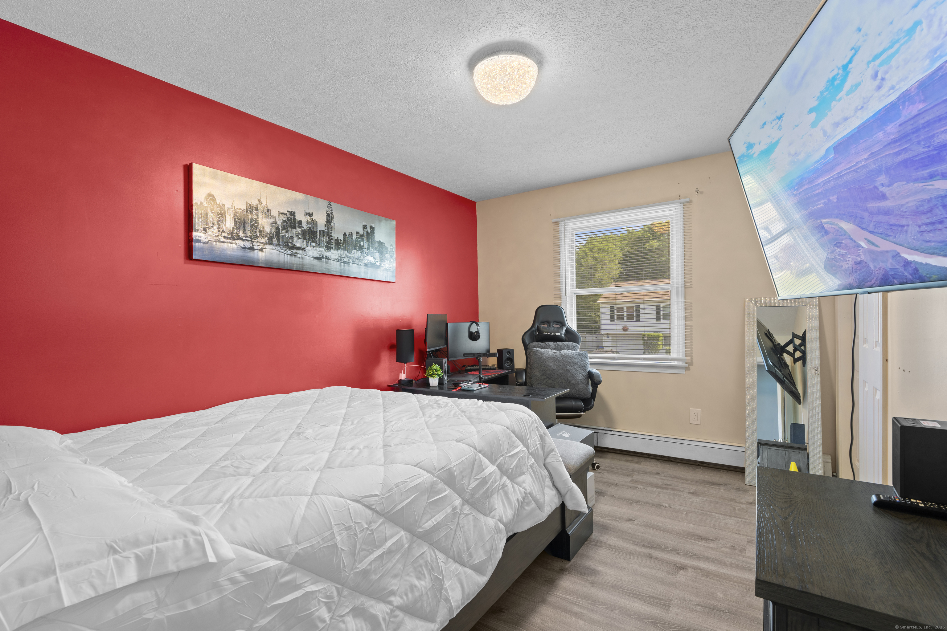 63 Johl Drive Groton, CT 06340 - Photo 25 of 40 a bed room with a bed tv and a window