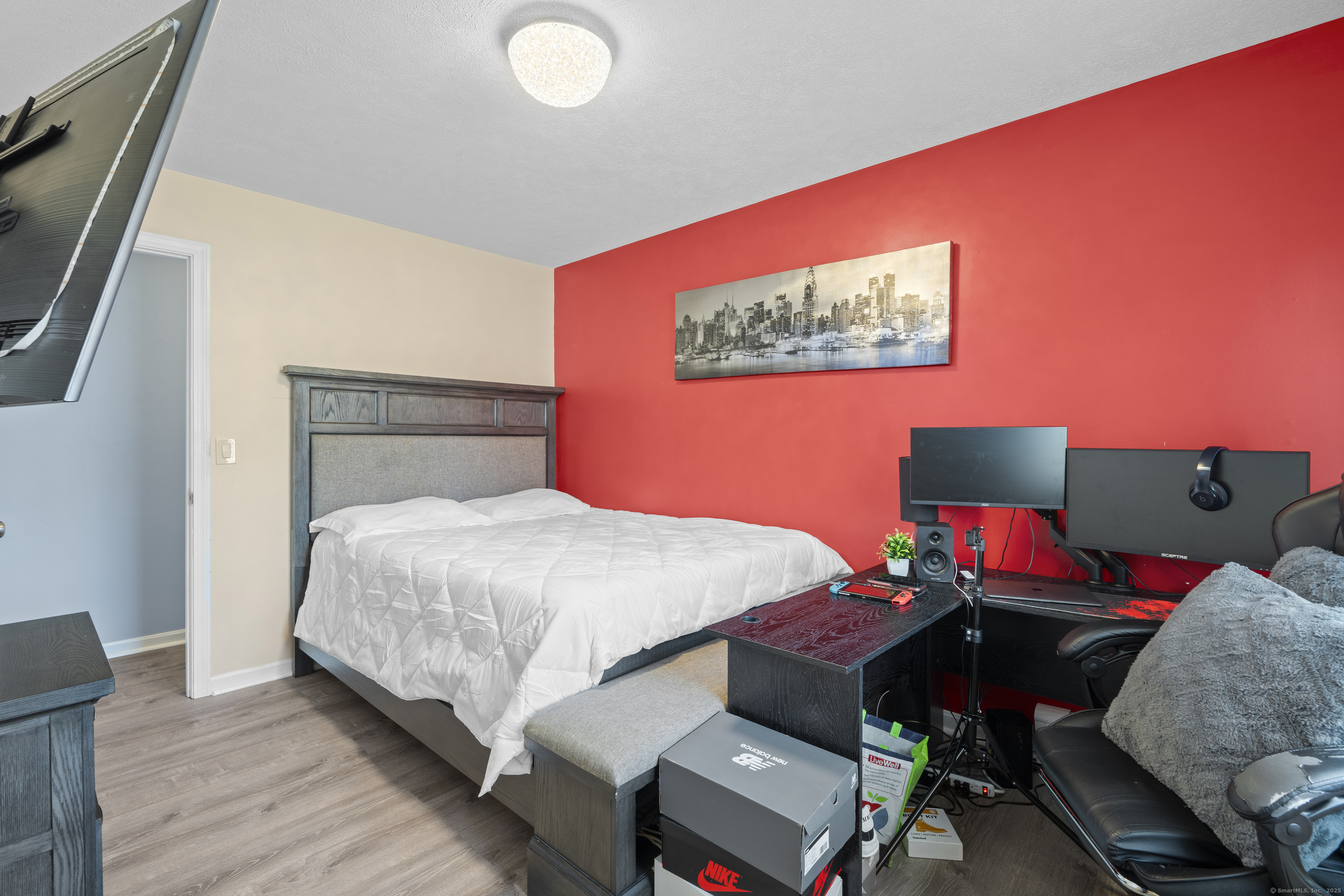 63 Johl Drive Groton, CT 06340 - Photo 26 of 40 a bedroom with a bed and wooden floor