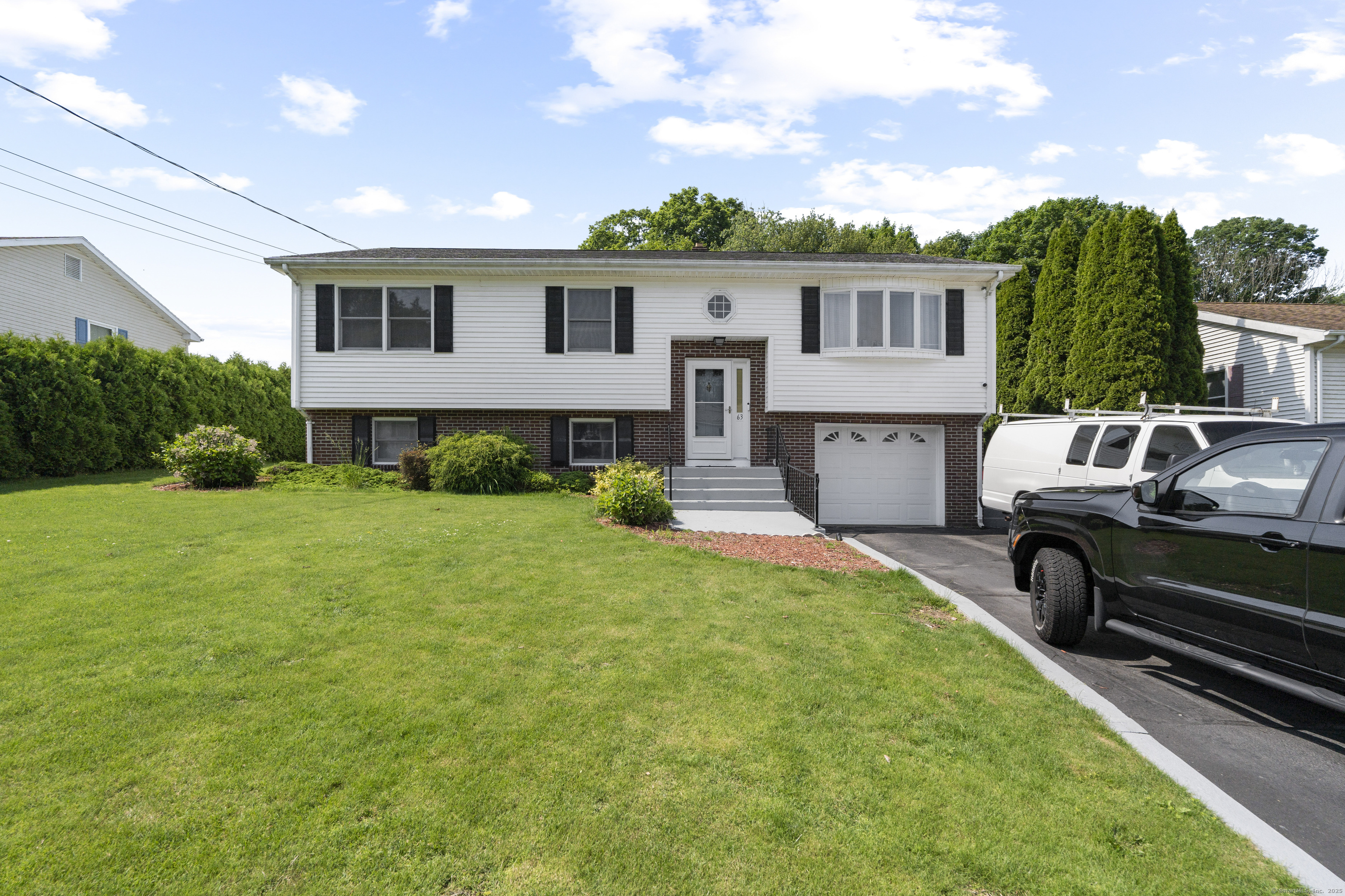 63 Johl Drive Groton, CT 06340 - Photo 28 of 40 a view of a house with a back yard