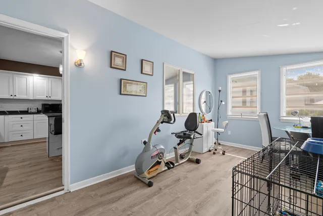 a view of a backyard with a garden and trees