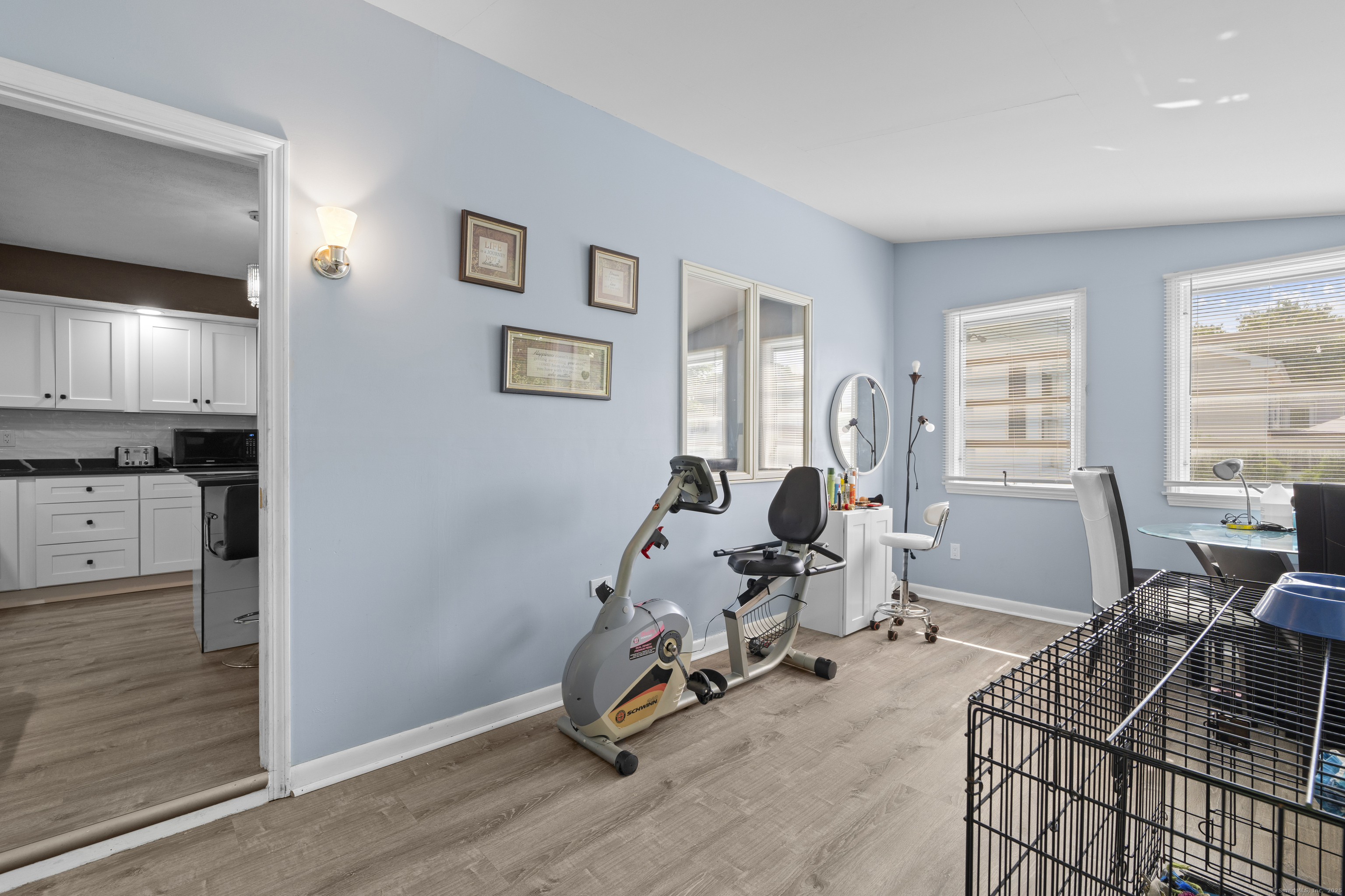 63 Johl Drive Groton, CT 06340 - Photo 30 of 40 a living room with furniture a window and gym equipment
