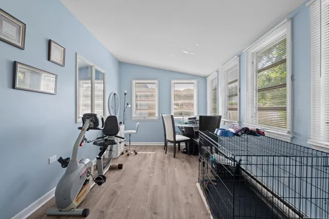 a view of a house with backyard and garden