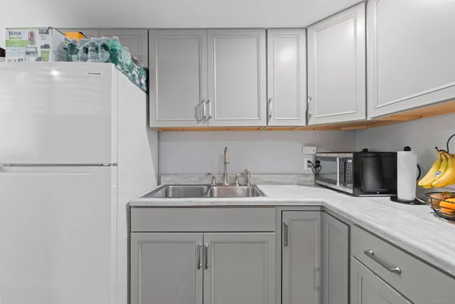 a bedroom with a bed and a couch