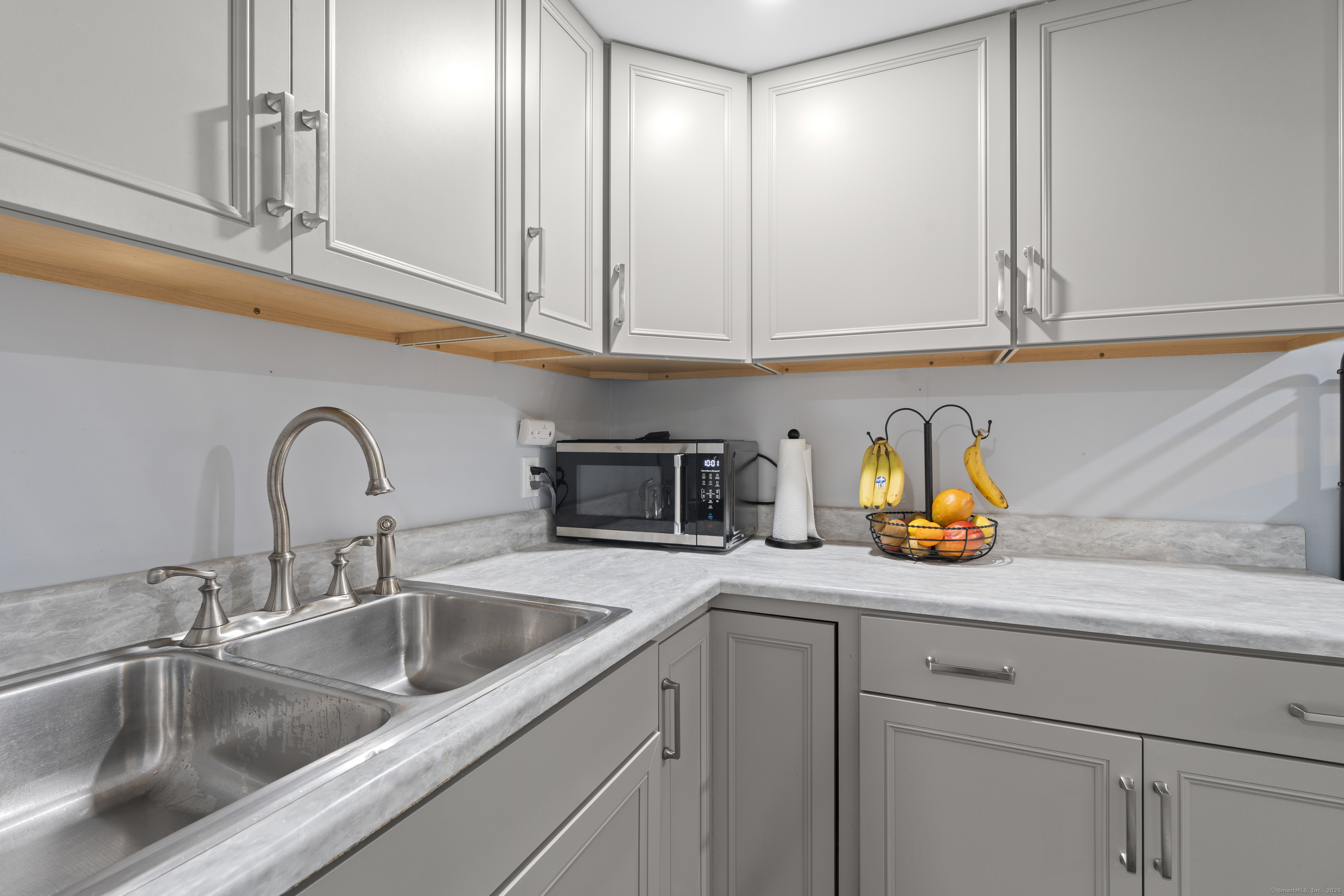 63 Johl Drive Groton, CT 06340 - Photo 35 of 40 a close view of a sink and cabinets