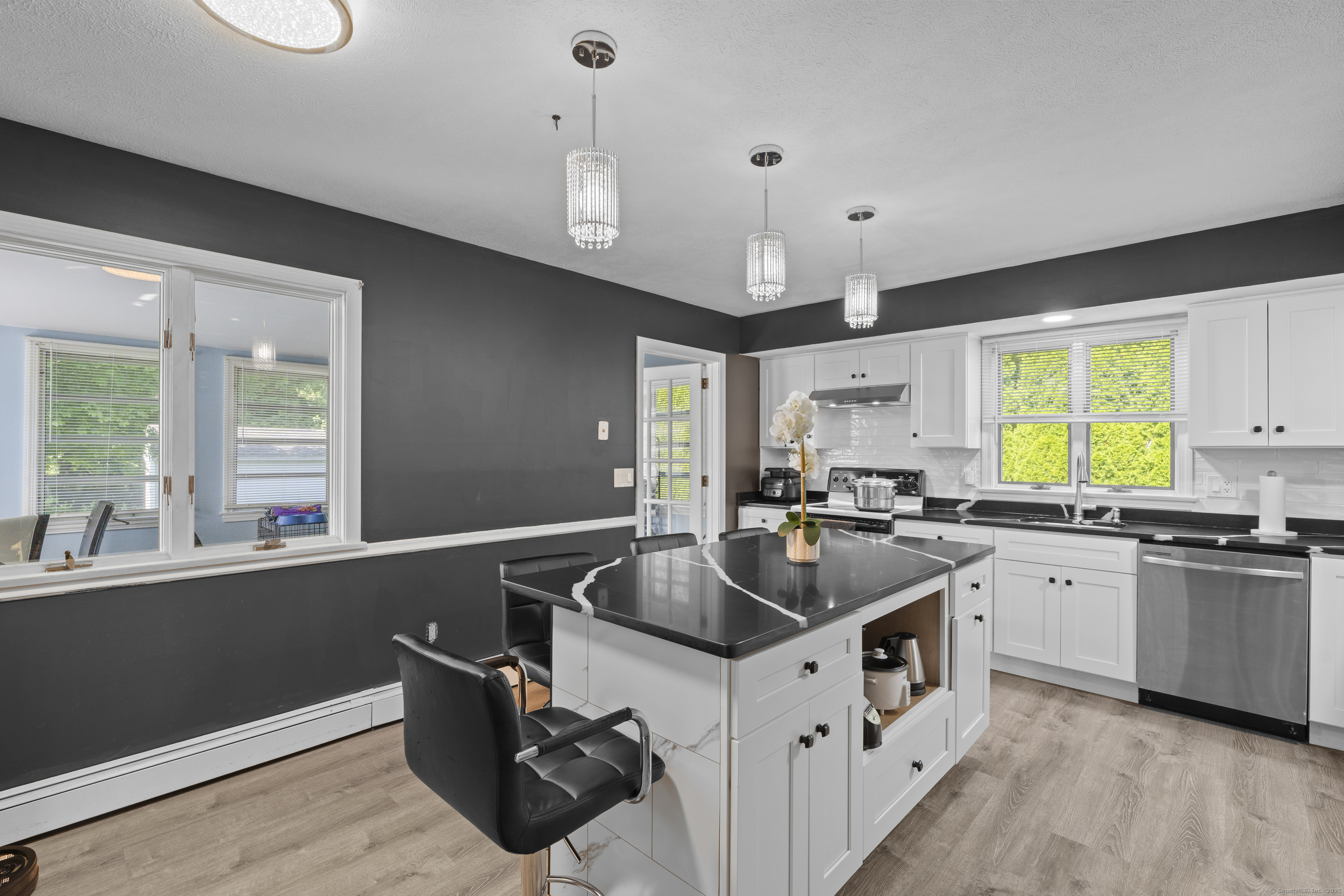 63 Johl Drive Groton, CT 06340 - Photo 7 of 40 a kitchen that has a sink and a stove in it