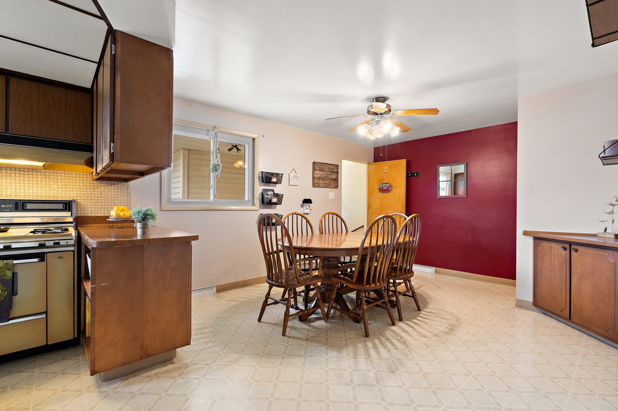 8014 Harrison Avenue Munster, IN 46321 - Photo 15 of 37 a view of a dining room with furniture and a flat screen tv