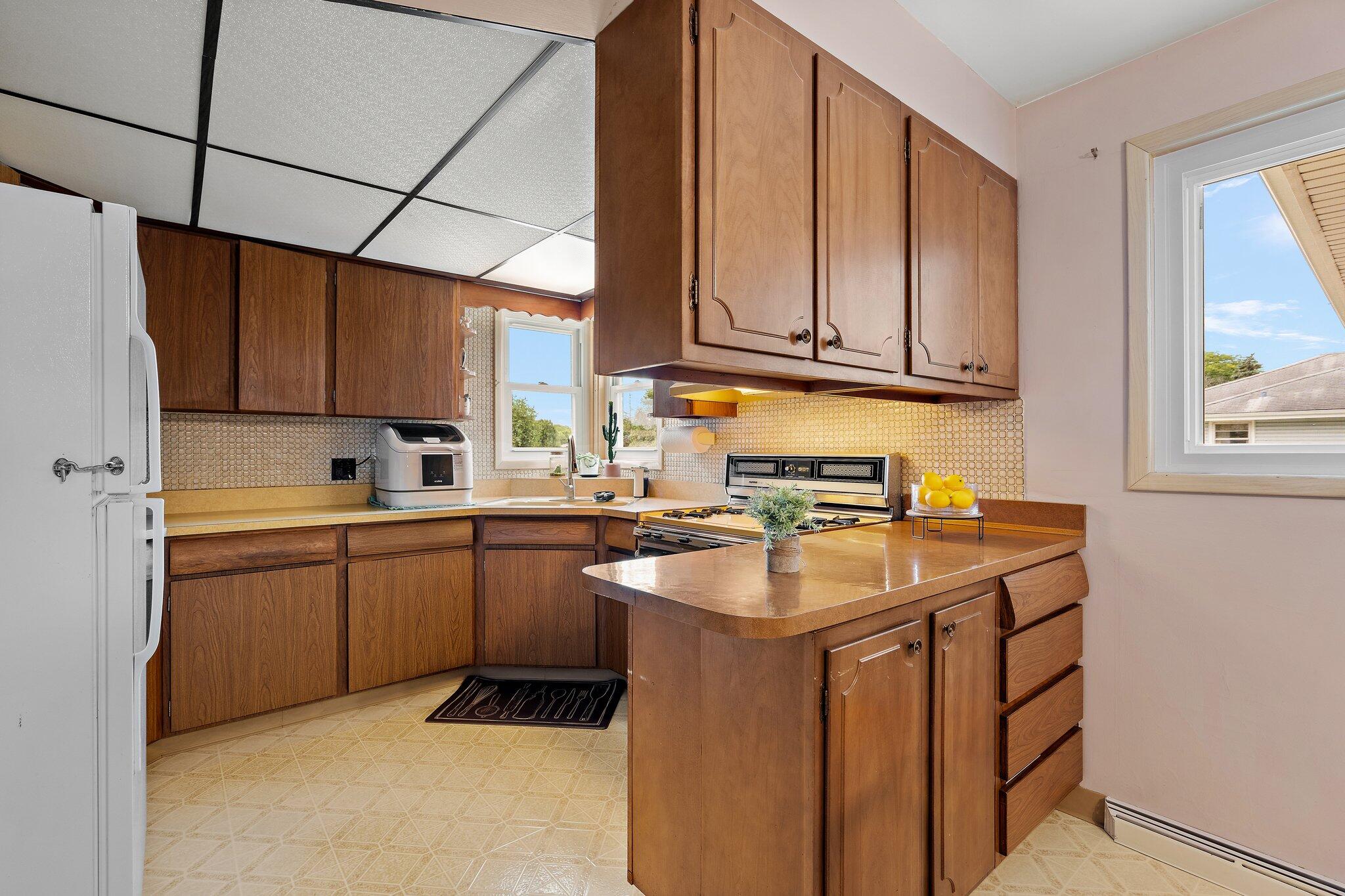 8014 Harrison Avenue Munster, IN 46321 - Photo 16 of 37 a kitchen with sink cabinets and window