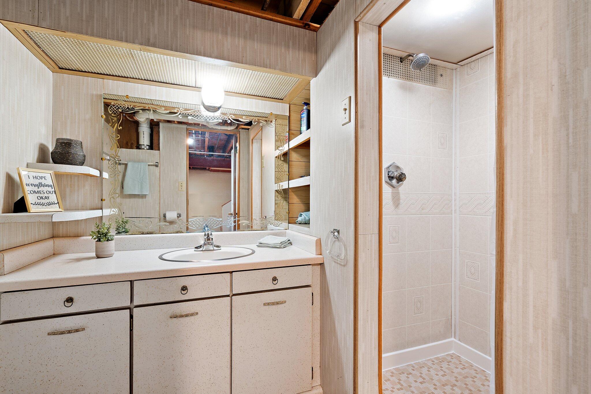8014 Harrison Avenue Munster, IN 46321 - Photo 24 of 37 a bathroom with a sink and a mirror