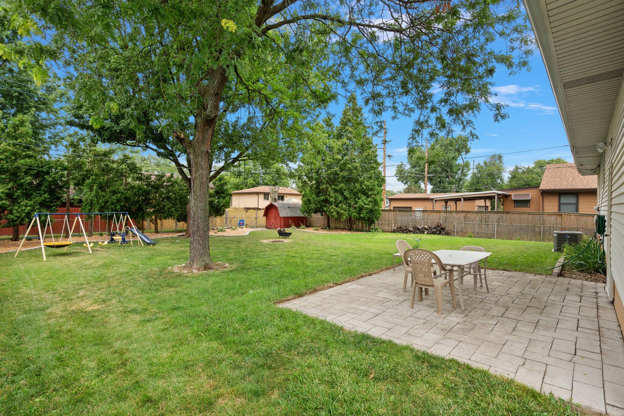 8014 Harrison Avenue Munster, IN 46321 - Photo 27 of 37 a view of a yard with a table and chairs